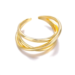 Detail showing the layered golden intertwined design of the adjustable open ring