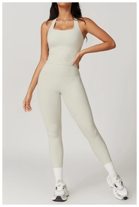 Detailed view of light grey square neck racerback yoga top and high waist leggings set