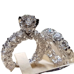 Elegant six-prong solitaire engagement ring set with micro-pave eternity band for women