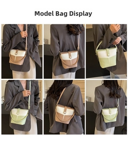 Prospettive multiple della borsa a secchiello bicolore indossata a spalla da modella