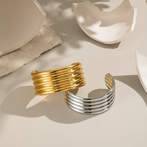 Minimalist multi-layer striped open bangles in gold and silver stainless steel finish