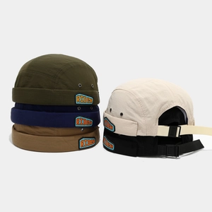 Retro brimless docker cap in quick-dry fabric with RIDER patch and adjustable strap