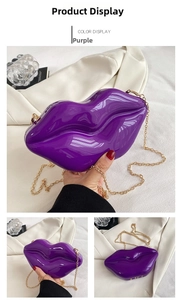 Detail view of purple lip-shaped acrylic clutch bag with golden chain strap and glossy finish
