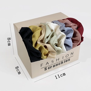 Set of 8 colorful satin scrunchies neatly displayed in a fashion gift box for hair styling