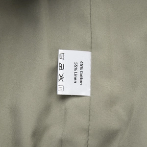 Detail shot of the garment label showing 45% cotton and 55% linen fabric composition