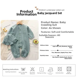 Infant romper detail showing sage green gauze fabric texture and wooden buttons with hat