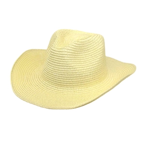 Detail of light yellow woven straw cowboy hat showing textured wide brim and indented crown