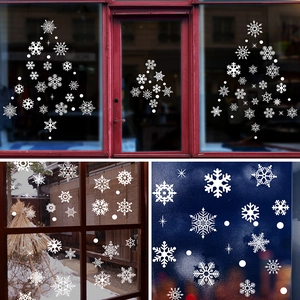 White snowflake window stickers for Christmas decor featuring various shapes and sizes