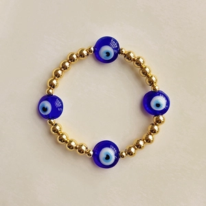 Ethnic 18K gold-plated beaded stretch bracelet with heart-shaped evil eye charms