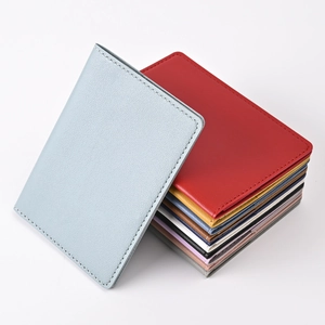 Detailed view of colorful PU leather passport holders and luggage tag sets in various colors