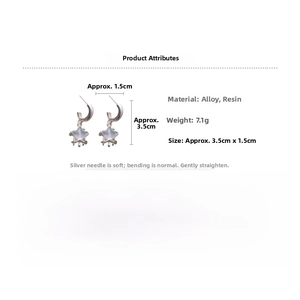 Detail view of star moon resin pendant earrings with size 3.5cm by 1.5cm markings