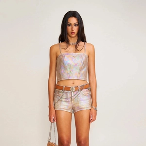 Futuristic iridescent denim two-piece set with heavy metal chain belt and cross buckle