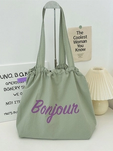 Light green waffle texture tote bag with purple Bonjour print for summer travel