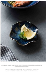Detail view of kiln-fired ceramic petal dish holding fresh lemon and mint leaves