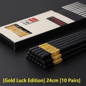Detail of black alloy chopsticks with gold character tips, 24cm length in 10-pair set