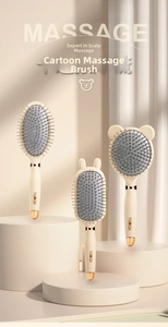 Detailed view of white cartoon massage combs with gold metallic accents and rabbit ears