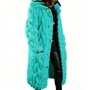 Close-up of turquoise cable knit texture and large buttons on long hooded cardigan
