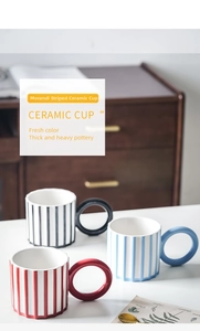 Detailed view of Morandi vertical striped ceramic mug with oversized circular handle