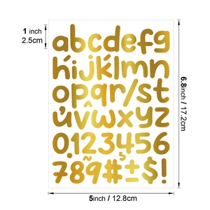 Macro detail of 1-inch metallic gold letter and number stickers for DIY gifts