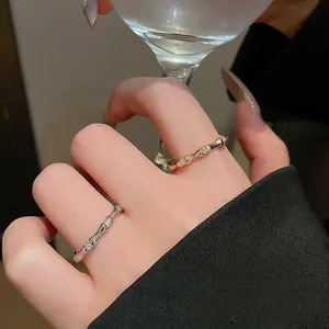 Chic bamboo style open ring with gold plating and sparkling zircon stones for women