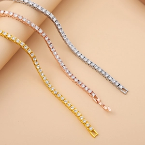 Detailed close-up of 4mm tennis bracelets in silver, rose gold, and gold finishes
