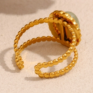 Detail of 18K gold plated beaded double band ring with green aventurine stone