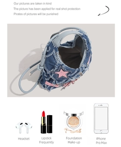 Internal storage view of star denim crossbody bag showing space for phone and makeup