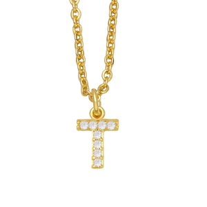 Macro view of gold-tone initial T pendant with micro-pave white zircon stones on cable chain