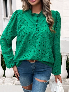 Detail of green eyelet embroidery long sleeve blouse with ruffle collar and buttons