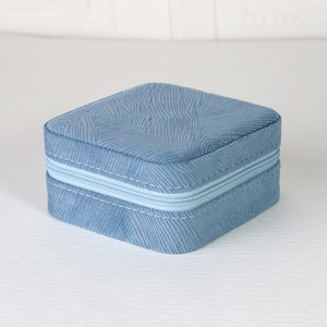 Sky blue velvet square jewelry box with textured wave pattern and nylon zipper close