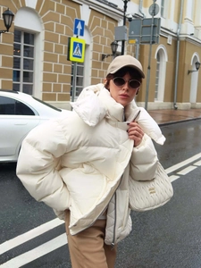 Women's white quilted puffer jacket with stand collar and loose winter silhouette