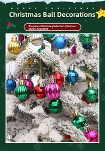Close-up of colorful textured Christmas balls hanging on snow-covered tree branches