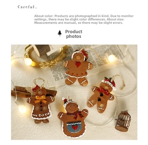 Detail view of resin gingerbread man ornaments set on cozy festive decor background