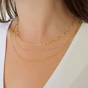 Three-layer gold stainless steel chain necklace featuring paperclip and figaro link styles