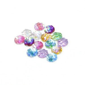 Close-up of 6mm round fish scale resin cabochons with iridescent AB color finish