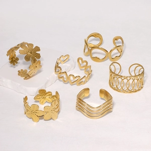 Set of six gold plated stainless steel bangles with floral and geometric designs