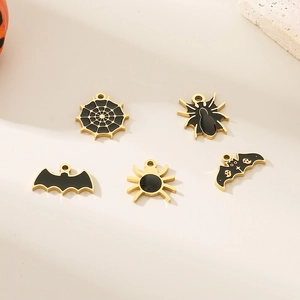 Detailed view of Halloween 18K gold plated spider and bat pendants with black enamel