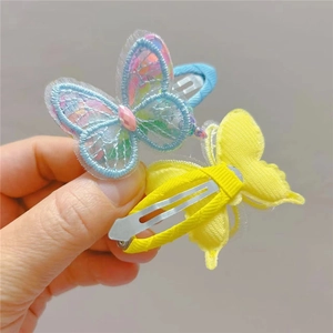 Detail of mesh embroidered butterfly hair clips with faux diamond and metal duckbill clip