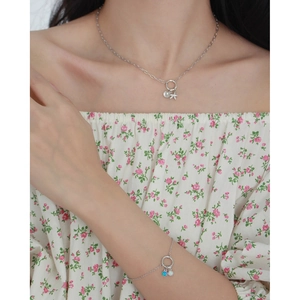 Silver necklace and bracelet set with pearls, airplane charm and blue round pendants