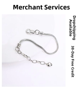 Silver snake chain bracelet with lobster clasp and a small heart pendant detail
