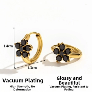 Detailed macro view of 1.4cm gold-plated flower hoop earrings with black zircon stones