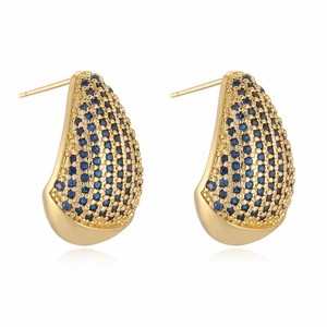 Minimalist gold teardrop earrings with pavé blue cubic zirconia on white background