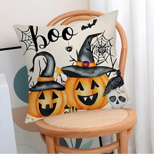 Halloween decorative pillowcase with pumpkins and wizard hats on a wooden chair