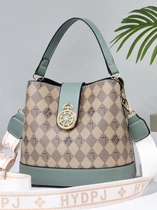 Fashionable green bucket bag with geometric patterns and a wide detachable shoulder strap