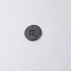 Detailed view of a black stainless steel Scorpio zodiac charm pendant for DIY jewelry