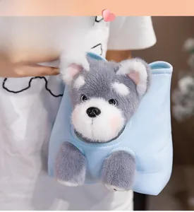 Close-up of a cute Schnauzer plush handbag featuring a soft blue fabric handle
