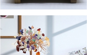 Detailed close-up of a wire-wrapped crystal tree of life with amethyst and agate base