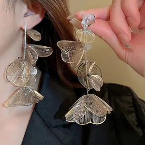 Exaggerated silver flower tassel earrings with long layered镂空 hollowed-out metal petals