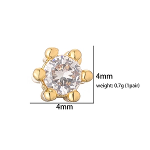 Detailed view of 4mm gold six-prong stud earrings with clear zirconia stones