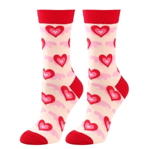 Knit mid-calf crew socks with red heart patterns for Valentine gift on white background